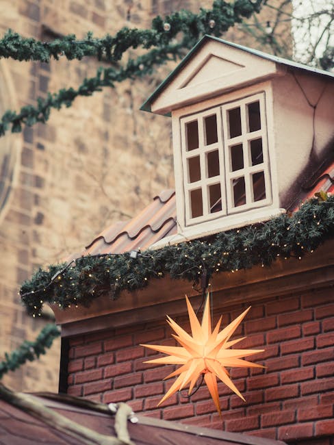 Christmas market stalls decorated with lights at night