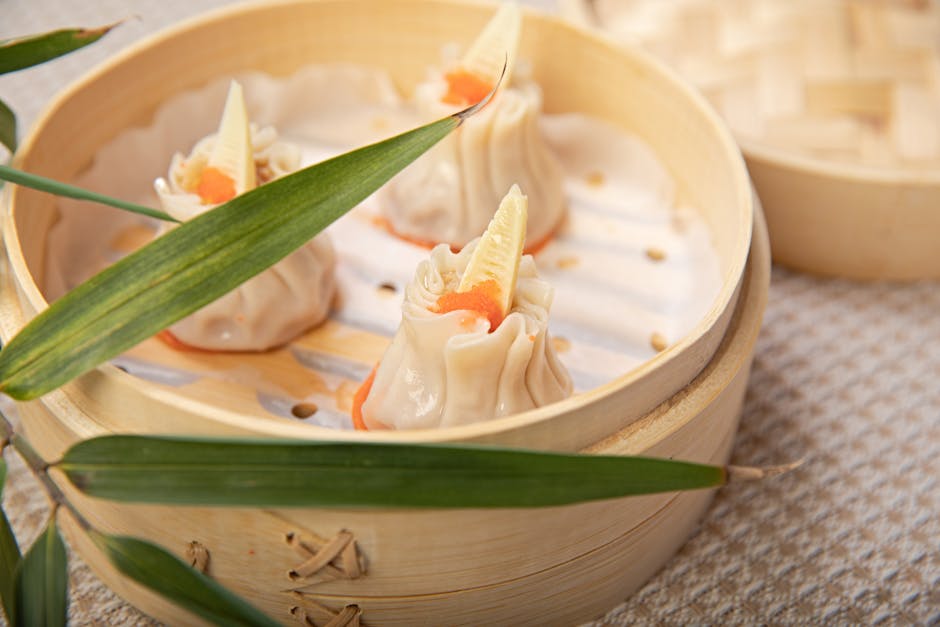 Dim sum dishes including dumplings in bamboo steamer baskets