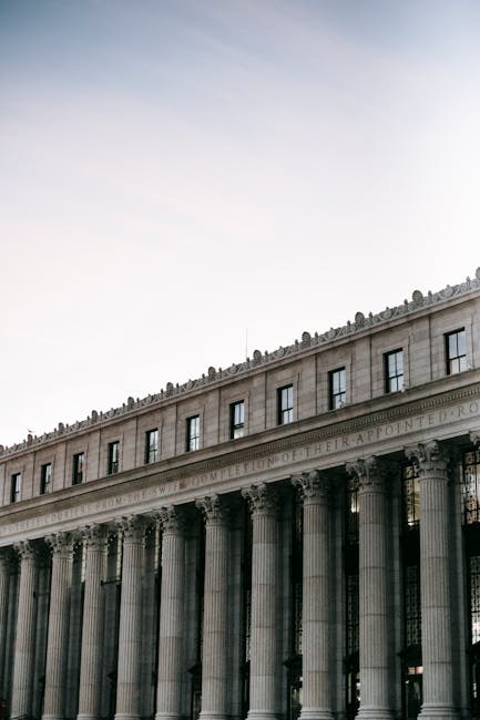 NYC City Hall building with people walking outside